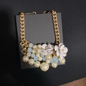 Modern chunky white flower necklace.